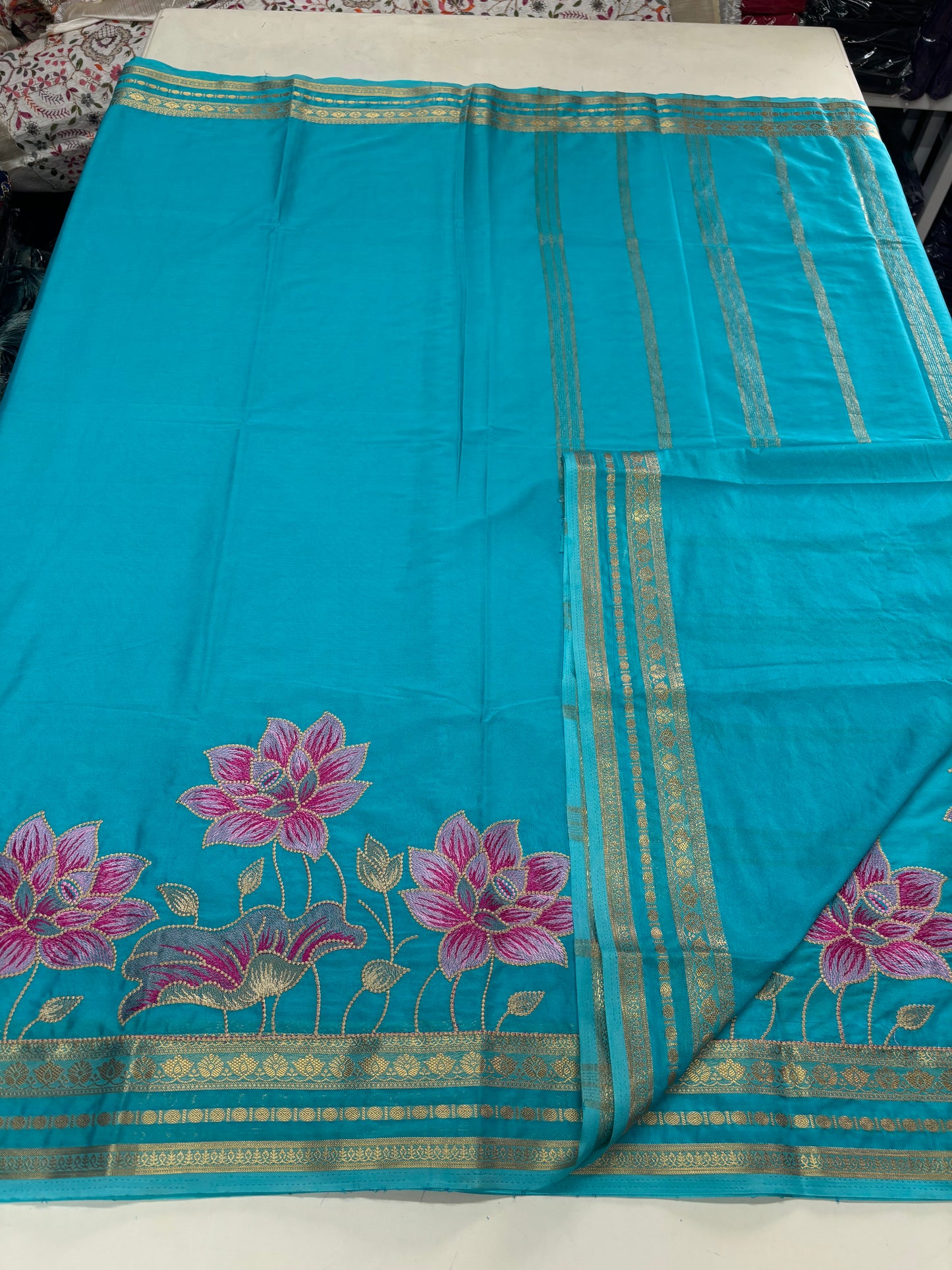 Semi Mysore Crepe(Premium, Small Lotus Bentex Border And Rich Floral Embroidery)